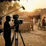 Mitti De Baway drama set: Mahira Khan and Wahaj Ali serial filming in a Punjab village courtyard at golden hour