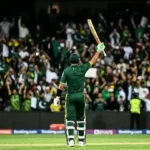 Pakistan cricketer raising his bat under floodlights after the ODI win against England at Rawalpindi