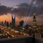 Riyadh skyline at dusk with air defence beams amid Houthi attack claims